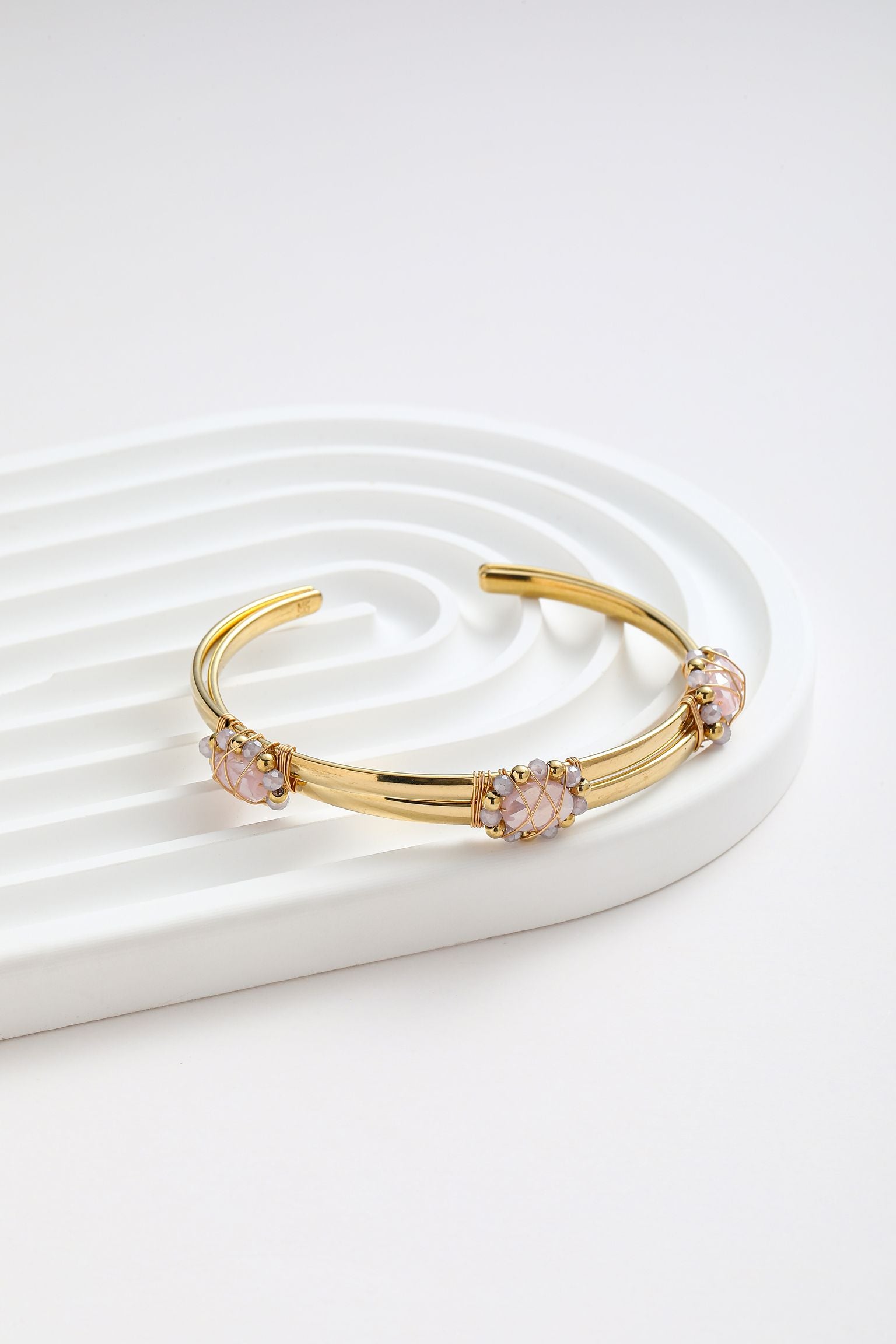 Bracciale rigido con treccio di cristalli
