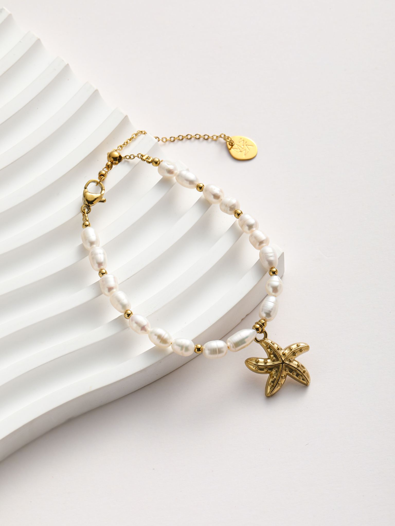 Bracciale perle fiume e stella marino