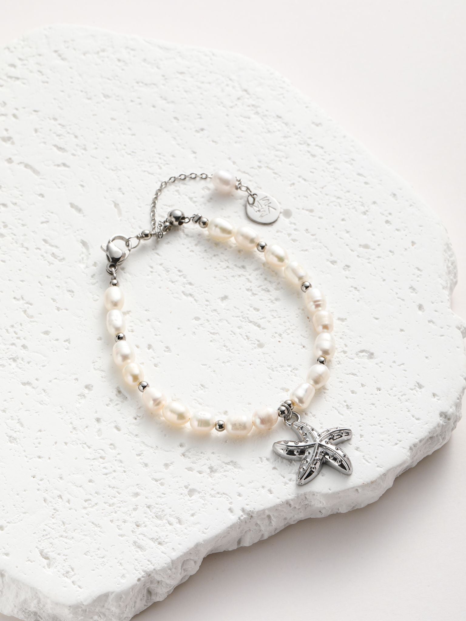 Bracciale perle fiume e stella marino